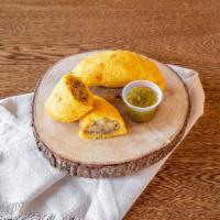 Empanadas de Carne · crispy yellow corn dough filled with beef and potato