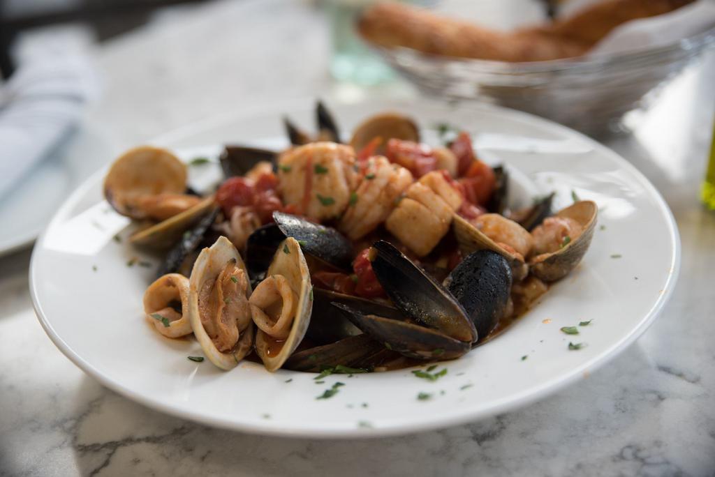 Misto di Pesce · Calamari, shrimp, scallops, littlenecks, and mussels sauteed in olive oil, sweet cherry tomatoes, tossed with linguine.