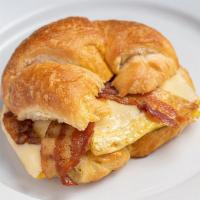 Breakfast Croissant · Scrambled eggs with white American Cheese and Bacon OR Ham on a fresh baked croisssant