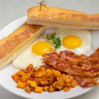 Breakfast Platter · 2 eggs any style with choice of Ham, Bacon OR Turkey Sausage with house potatoes ＆ Cuban toast