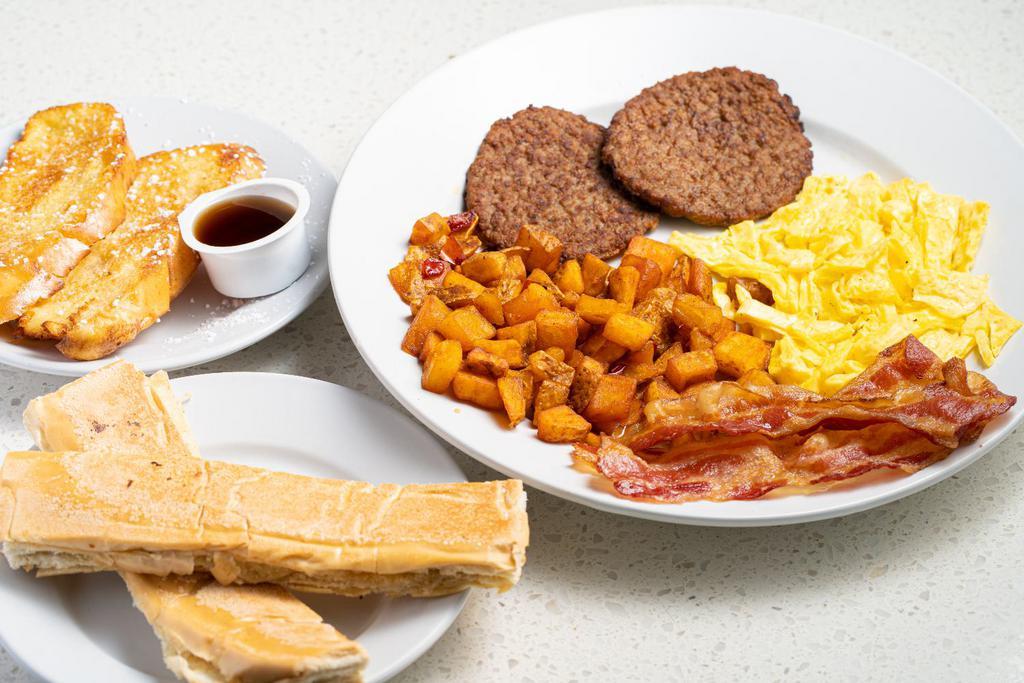 Breakfast Sampler · French Toast, Eggs, Bacon slices, Turkey Sausage, House Potatoes ＆ Cuban toast with side of Maple Syrup