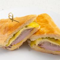 Cuban Sandwich / Cubano · Roasted Pork, Ham, Swiss Cheese, Pickles ＆ Mustard on toasted Cuban Bread