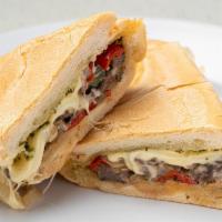 Cuban Philly Sandwich · Thin slices of Skirt Steak, grilled onions ＆ peppers, melted Swiss cheese topped with Chimic...