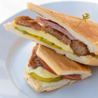 Croqueta Preparada Sandwich / Croqueta · Ham Croquettes, melted Swiss cheese, ham, mustard ＆ pickles on toasted Cuban bread