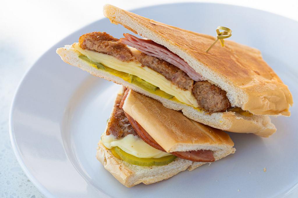 Croqueta Preparada Sandwich / Croqueta · Ham Croquettes, melted Swiss cheese, ham, mustard ＆ pickles on toasted Cuban bread