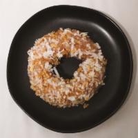 Triple Coconut · A moist coconut cake doughnut, finished with a coconut glaze and topped with toasted coconut.