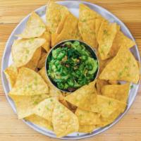 Chips and Guacamole · Hass avocados, onion, serrano chiles, lime, pistachios, cilantro. Vegan.