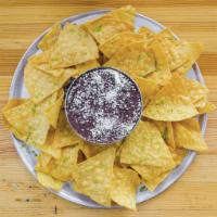 Chips and Cheesy Bean Dip · Beans, cheese blend, pickled jalapenos, Cotija cheese, served with tortilla chips.