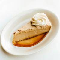 Dulce de Leche Cheesecake · Cajeta, whipped cream.