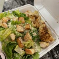 Chicken Caesar Salad · Pita, Caesar dressing, romaine, croutons, grated cheese and grill chicken.