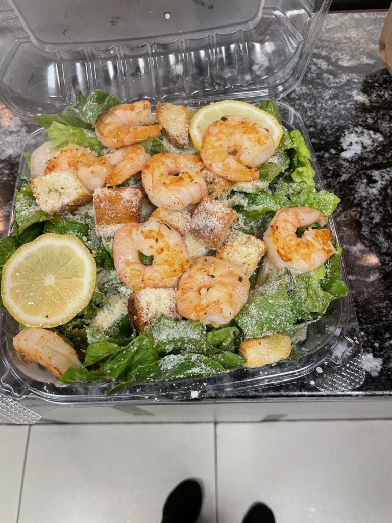 Shrimp Caesar Salad · Pita, Caesar dressing, grated cheese, croutons, romaine and grilled shrimp.