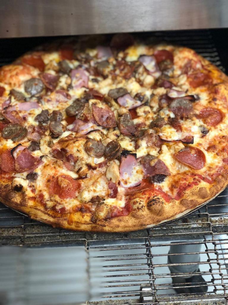 Meat Lovers Pizza · Pizza sauce, cheese, pepperoni, salami, sausage, ham, hamburger, chicken and bacon.