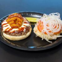 Rodeo Burger · 1/2 lb. Black Angus burger, 2 onion rings, BBQ sauce and choice of cheese.