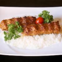 28. Chicken Lula Kabab Dinner · Ground chicken with spices, broiled on skewers over open flame. Served with rice, hummus, sa...