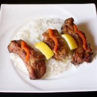 39. Lamb Chops Dinner · Choice lamb, marinated in special pomegranate sauce and wine and grilled. Served with rice, ...