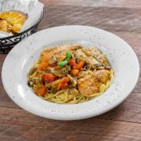 Chicken Marsala · Boneless chicken breast sauteed with button mushrooms and tomatoes in a marsala sauce, serve...