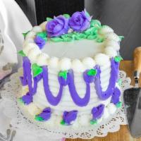  Round Cake · Double-layer white cake with your choice of white or chocolate icing. Also HBD name and trim...