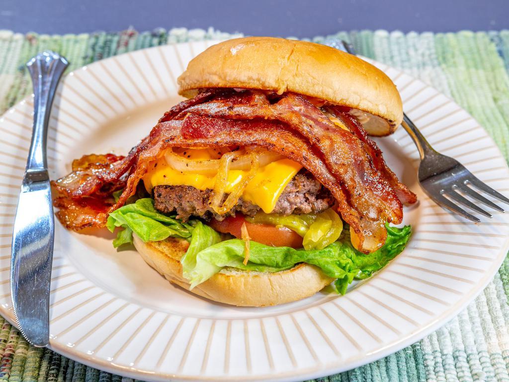 The Bacon Barron Burger · 100% naturally seasoned organic ground beef patty, cheddar cheese, thick slices of bacon, tomato, lettuce, caramelized onion, on a golden brown toasted bun.