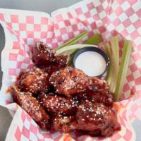 Munchie's Famous Korean BBQ Wings · The Best Wings in the Galaxy!  Sweet, Tangy, and Meaty with sesame seeds sprinkled on top an...