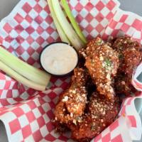 Spicy Italian Wings · Italian spices with parmesan sprinkled on top, served with dipping sauce and celery 