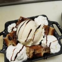 Waffels & Cream · Deep fried Belgian waffle topped with a scoop of our very rich and creamy vanilla bean ice c...