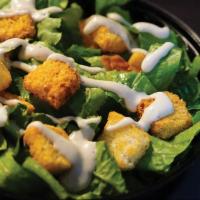 Caesar Salad · Crisp romaine tossed with croutons, Caesar dressing, and grated cheese.