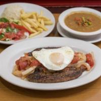 Punta de Anca a Caballo · 12 oz. Tri-tip sauteed with onions, tomatoes, a fried egg, rice, beans, salad, and french fr...