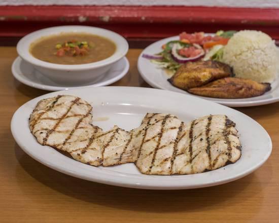 Pollo a La Plancha · Grilled chicken breast with rice, beans, salad and sweet plantains.