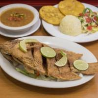 Mojarra · Whole deep-fried tilapia fish. Served with red beans, white rice, green plantain and salad.