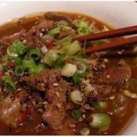 Szechuan Beef · Served with steamed rice. Hot and spicy. 