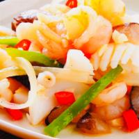 Seafood Delight · Sauteed scallops, shrimp, squid, fish and garden greens with light sauce. Served with steame...