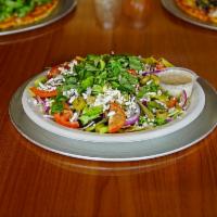 Greek Feta Salad · Romaine lettuce and mixed greens, Kalamata olives, tomatoes, bell peppers, onions, basil, fe...
