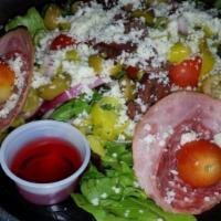 Antipasto Salad · Romaine lettuce and mixed greens, salami, ham, tomatoes, black and green olives, onions, pep...