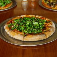 BBQ Chicken Pizza · BBQ sauce, chicken, red onions and fresh cilantro.
