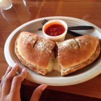 Meat Calzone · Monterey Jack and mozzarella cheese, salami, canadian bacon, pepperoni, sausage, linguica, b...