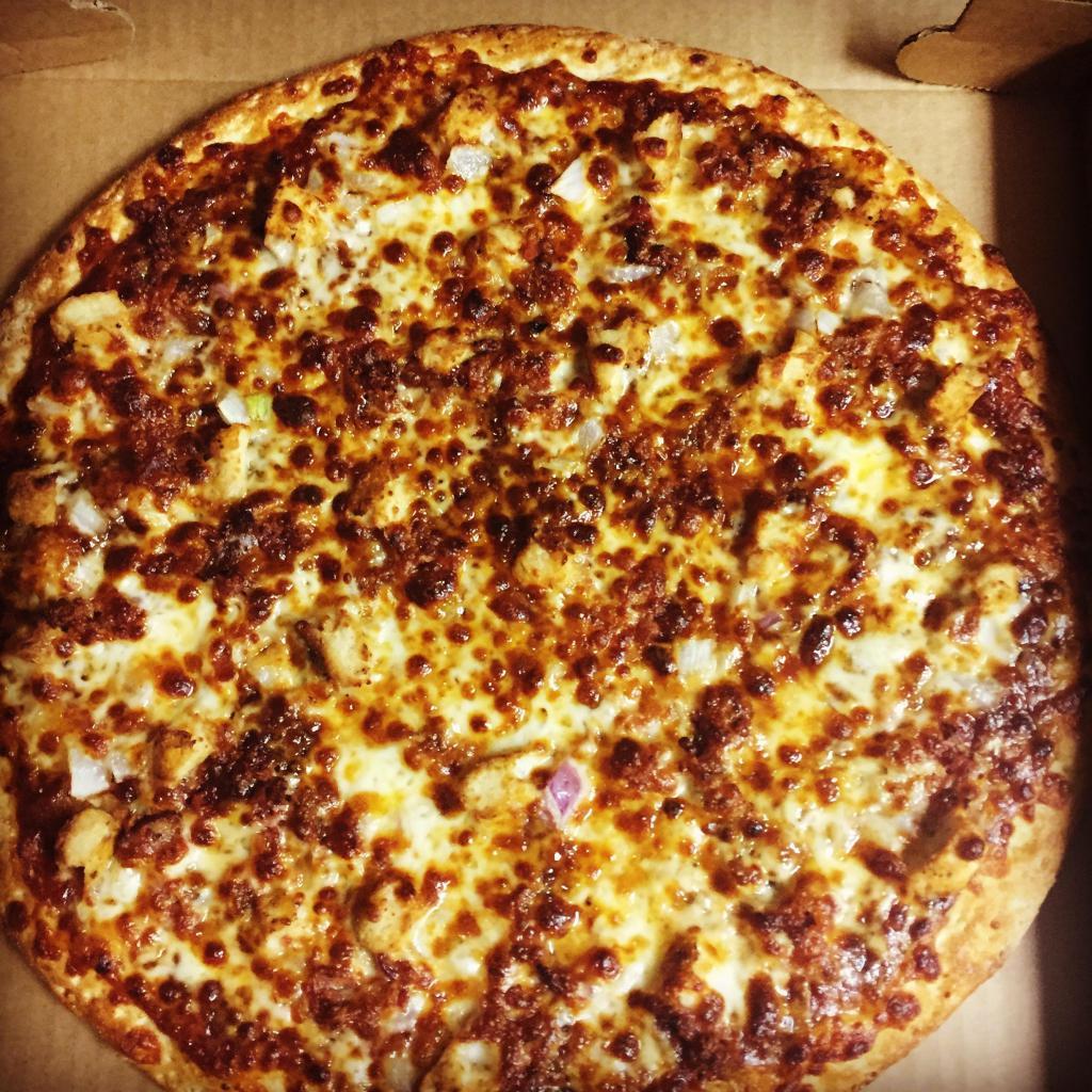 Smokey BBQ Chicken Gourmet Pizza · BBQ chicken, sliced onions and bacon with BBQ sauce and cheese.