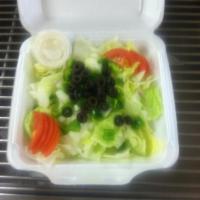 Tossed Salad · Served with tomato, onion, green peppers and olives.