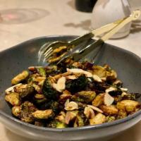 Crispy Brussels Sprouts · Chopped parsley and sliced almond.