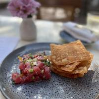 Tuna Tartar · Onion, cilantro, and mint mixed in chili lime sauce with wonton chip on side.