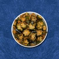 Stir Fried Okra  · Stir-fried okra cooked with onion, tomato, garlic and Indian spices
