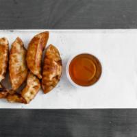 Gyoza Potstickers · Chicken and vegetables potstickers fried to golden crisp served with gyoza sauce.  6 per order