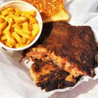Rib Basket · 4 Slow smoked St Louis style spare ribs with a choice of side.
