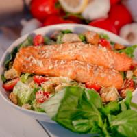 King Caesar Salad · Romaine, grilled salmon, roasted tomatoes, shredded Parmesan cheese, croutons with homemade ...