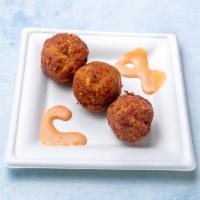 Crab Balls · Claw crab seasoned and rolled into a ball and deep fried in our homemade dry batter.