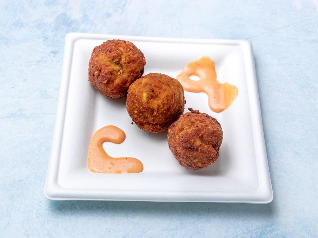 Crab Balls · Claw crab seasoned and rolled into a ball and deep fried in our homemade dry batter.