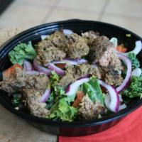 Beef Salad Bowl · A salad bowl consisting of kale, brussel sprouts, onions, tomatoes, and beef served with our...