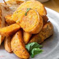 Potato Wedges · Potato wedges that we add our own special flavoring to and then bake (not fry) for a delicio...