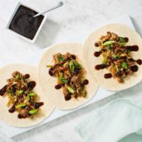 Moo Shu · Wrap your own crepes with a filling of mushroom ears, cabbage, onions and eggs.