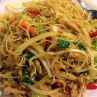 Singapore Noodles · Rice noodles made with yellow curry, bean sprouts, green onions and white onions.
