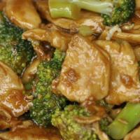 Chicken with Broccoli · Stir-fried chicken with broccoli and carrots, all in a white sauce.